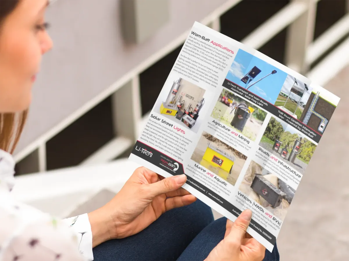 Person reading the Wom-Batt applications brochure
